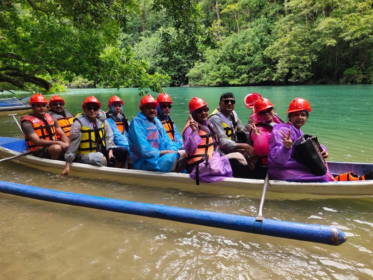 Bangladeshi doctors wearing life jackets and helmets aboard a boat on their way to the Puerto Princesa Underground River in Palawan, Philippines.