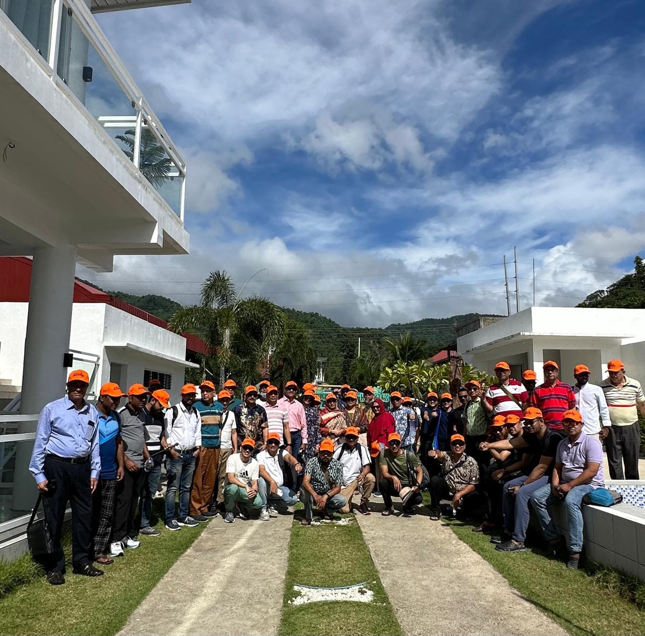 A group of pharmaceutical doctors gathered at the shore before their Taal Volcano Island Hopping Tour in the Philippines, organized by Creative Journeys Travel & Tours Inc.